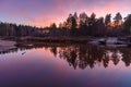 Pink sunset in the forest. Reflection in water forest and sunset. Russia Royalty Free Stock Photo