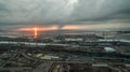 Pink sunset in the gray clouds above the sea in the port Royalty Free Stock Photo