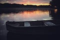 Pink sunset on the lake with an old boat. Blurred natural background, Sunset sky over lake Royalty Free Stock Photo