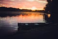 Pink sunset on the lake with an old boat. Blurred natural background, Sunset sky over lake Royalty Free Stock Photo