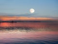 Pink sunset on sea water waves reflection full moon on evening blue light cloudy sky summer night   nature landscape Royalty Free Stock Photo