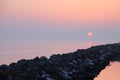 Pink sunset at the stone pier Royalty Free Stock Photo