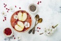 Pink superfoods smoothie bowl with chia seeds, pomegranate, sliced apples and honey. Overhead, top view, flat lay, copy space. Royalty Free Stock Photo