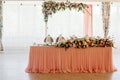 Pink table decor with flowers for a wedding party