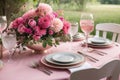 Pink table setting with flower centerpiece Royalty Free Stock Photo