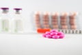 Pink tablet on medicine background Royalty Free Stock Photo