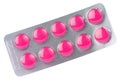 Pink tablet in transparent blister pack