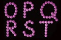 Pink tablets alphabet Royalty Free Stock Photo