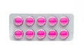 Pink tablets pills in blister pack isolated on white background. Royalty Free Stock Photo