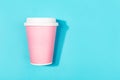 Pink take out cup on aqua color background