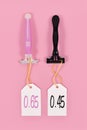 Pink tax and gender stereotypes concept showing pink and black razors marketed to specific genders