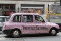 London, United Kingdom- June 2019: Pink Taxi in London Traffic Road, England