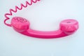 Pink telephone on a white background Royalty Free Stock Photo