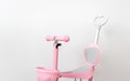 Pink toddler scooter for a baby. Summertime activity for kids. Royalty Free Stock Photo