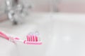 Pink toothbrush with toothpaste. Small depth of field. Royalty Free Stock Photo