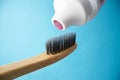 Pink toothpaste on a natural bamboo toothbrush Royalty Free Stock Photo