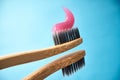 Pink toothpaste on a natural bamboo toothbrush Royalty Free Stock Photo