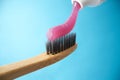 Pink toothpaste on a natural bamboo toothbrush Royalty Free Stock Photo