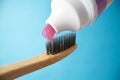 Pink toothpaste on a natural bamboo toothbrush Royalty Free Stock Photo