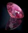 Pink tourmaline gem stone on black