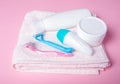 Pink towel, jar cream, lotion, razor, roller deodorant soft beauty Royalty Free Stock Photo