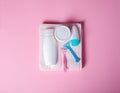 Pink towel, jar cream, lotion, razor, roller deodorant soft beauty Royalty Free Stock Photo