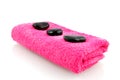 Pink towel with massage stones Royalty Free Stock Photo