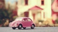 Pink toy classic car on the background of a blurred dollhouse. Toy world Royalty Free Stock Photo