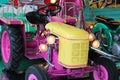 Pink tractor on a children carousel