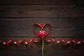 Pink tulip and ribbon shaped heart on wooden background. Valentines day, Mothers Day, Happy Birthday, Wedding, Womens Day -Concept