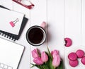 Pink tulips and accessories on white wooden table Royalty Free Stock Photo