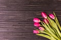 Pink tulips on the black background. Flat lay, top view. purple easter tulips arrangement with space for text Royalty Free Stock Photo