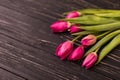 Pink tulips on the black background. Flat lay, top view. purple easter tulips arrangement with space for text Royalty Free Stock Photo