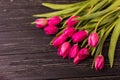 Pink tulips on the black background. Flat lay, top view. purple easter tulips arrangement with space for text Royalty Free Stock Photo