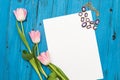 Pink tulips on a blue wooden board Royalty Free Stock Photo