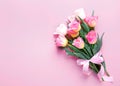 Pink tulips bouquet on empty space background.