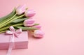 pink tulips and box on wooden background pink tulips and box bouquet of tulips Royalty Free Stock Photo