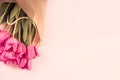 Pink tulips with pearls on a pastel backdrop. Copyspace.Pink tulips with pearls on a pastel backdrop. Copyspace