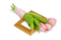 Pink tulips with satin ribbon on the wooden frame Royalty Free Stock Photo