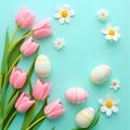 Pink tulips, white daisies, and pastel-decorated Easter eggs arranged on light turquoise festive background Royalty Free Stock Photo