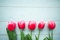 Pink tulips on wooden background. Flat lay, top view, copy space. Royalty Free Stock Photo