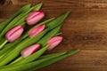 Pink tulips on a wooden background. Mother`s Day. Spring flowers Royalty Free Stock Photo