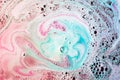 pink turquoise bath bomb dissolving water. High quality beautiful photo concept Royalty Free Stock Photo