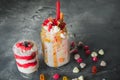 Pink unicorn milkshake with whipped cream and sweet dessert, dripping sauce and sugar candy