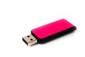 A pink USB flash drive with a plastic case, shot against a white background Royalty Free Stock Photo