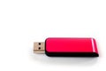 A pink USB flash drive with a plastic case, shot against a white background Royalty Free Stock Photo