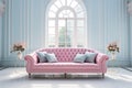 Pink velvet couch in the room with grey walls and flowers Royalty Free Stock Photo
