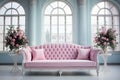 Pink velvet couch in the room with grey walls and flowers Royalty Free Stock Photo