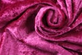 Pink velvet swirling in waves, texture