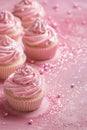 Pink vertical background with glittering cupcakes, copy space. Womens Day. Its a girl backdrop with empty space. Baby Royalty Free Stock Photo